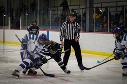 Katie Parkman ’17 fights for the puck against a Bowdoin defender. (PHOTO: Jade Thomas '20)